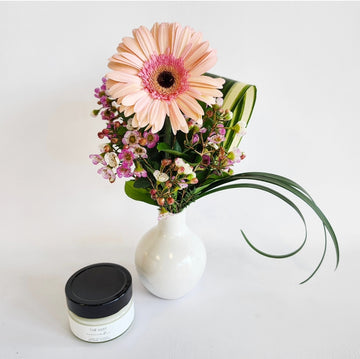 Arrangement gerbera rose et bougie